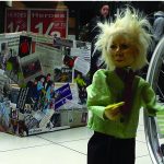 puppet beside a wheelchair